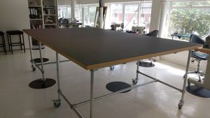 Cutting table top onto industrial type base