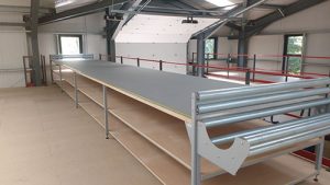 Fabric Cutting table complete with roll storage, layout length rollers and measure