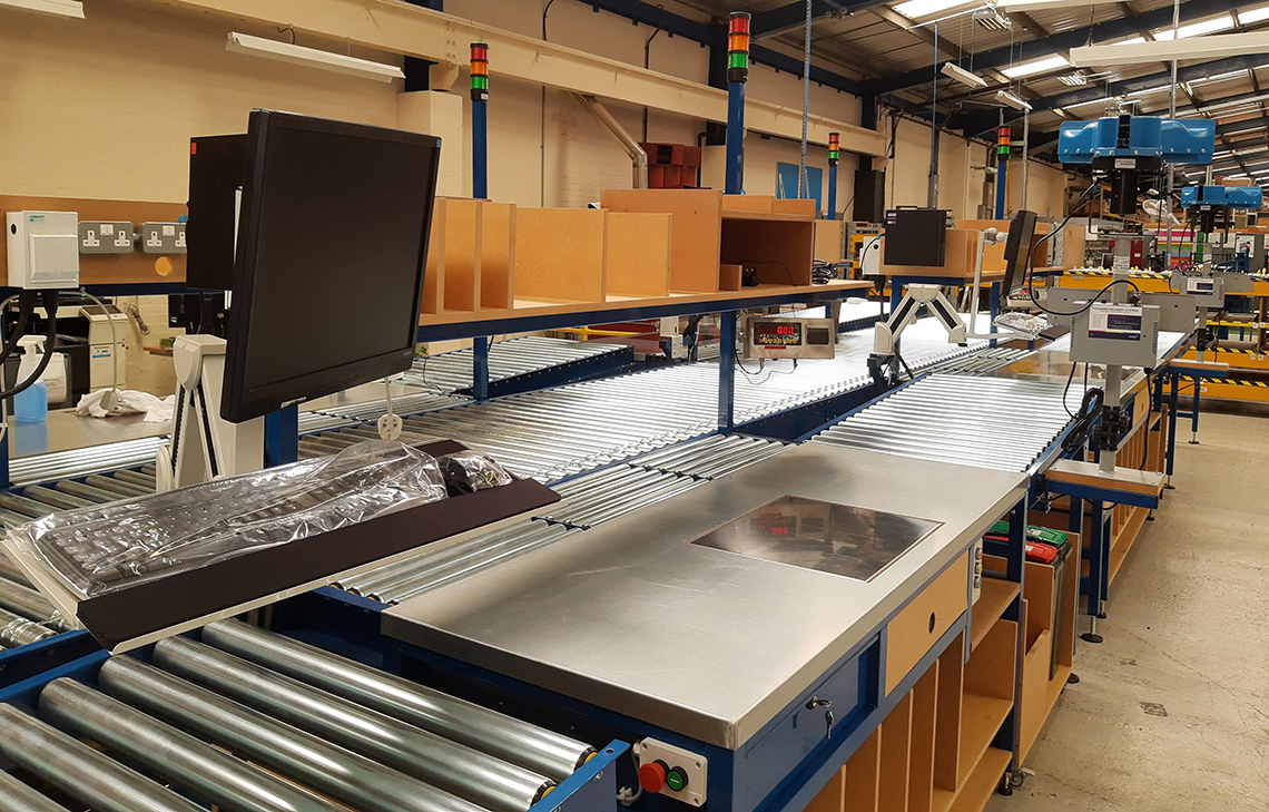 Lean packing cell Lean packing with powered roller conveyor take away