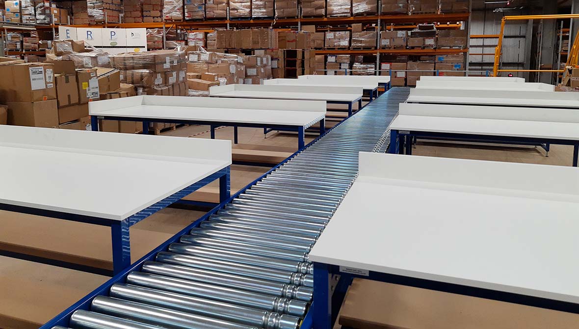 Lineshaft driven roller conveyor used within ecommerce packing