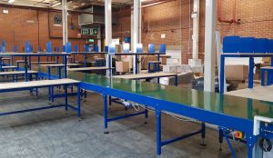 belt conveyor line with packing tables