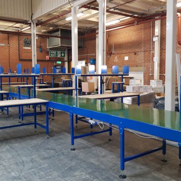 belt conveyor line with packing tables