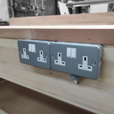 Wooden workbench with sockets