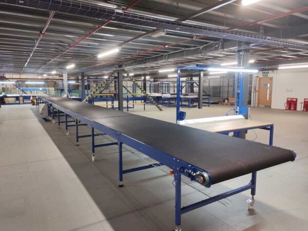Long belt conveyor for electronics processing