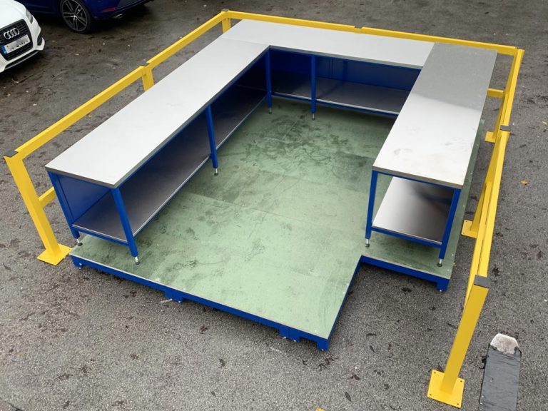 Raised team leader workstation with forklift barriers